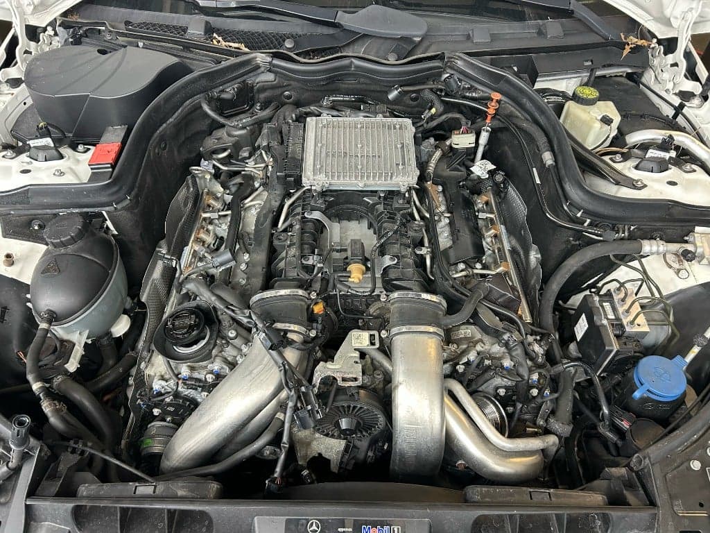 Mercedes-Benz V8 engine bay during service at Beloit Motor Werks